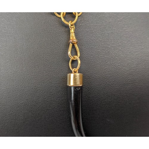 12 - AN 18CT GOLD ALBERT CHAIN, with a ebony tusk pendant, 142 cm / 56 inches long, total gold weight, 35... 