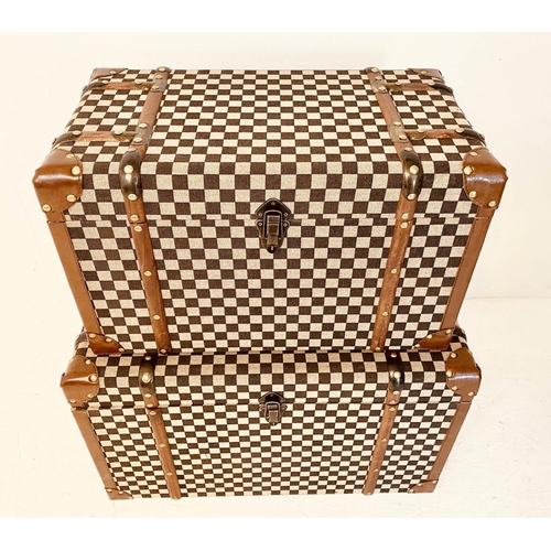 473 - TRUNKS, graduated pair, 42cm high, 72cm wide, 42cm deep, damier style upholstered. (2)