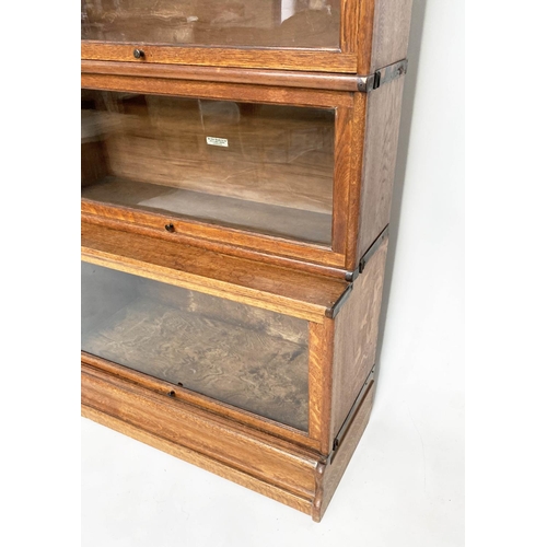 152 - GLOBE WERNICKE BOOKCASE, a graduated set of five, oak stacking glazed with cornice, plinth and label... 