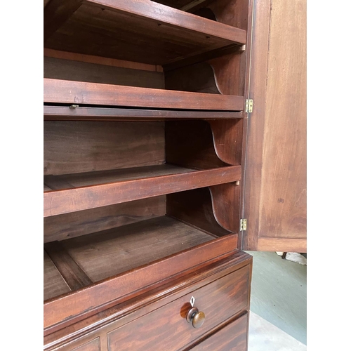 156 - LINEN PRESS, George III flame mahogany with oval panelled doors enclosing original trays and well sp... 