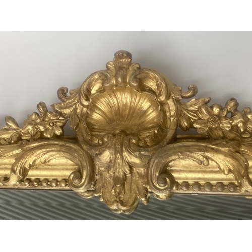 167 - OVERMANTEL MIRROR, 19th century French giltwood and gesso moulded with arched beaded frame and shell... 