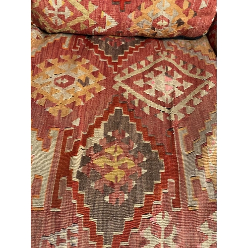 157 - KILIM ARMCHAIR, early 20th century in the manner of Howard Sons with antique kilim upholstery and sq... 