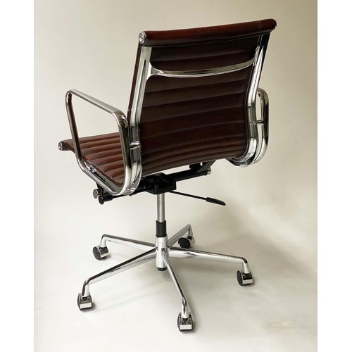 231 - REVOLVING DESK CHAIR, Charles and Ray Eames inspired with ribbed tan leather seat revolving and recl... 