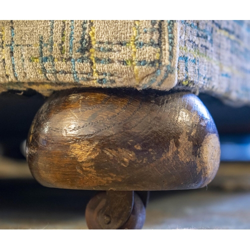 213 - DROP END SOFA, early 20th century in cut patterned grey velvet on old and modern castors.