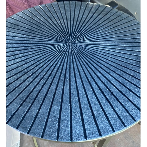 379 - NEST OF TABLES, a graduated pair, 62cm x 45cm diam. at largest, sunburst design tops in differing co... 