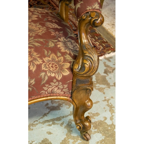 196 - SOFA, 81cm H x 193cm W, circa 1860, Victorian walnut in floral burgundy fabric on ceramic castors.