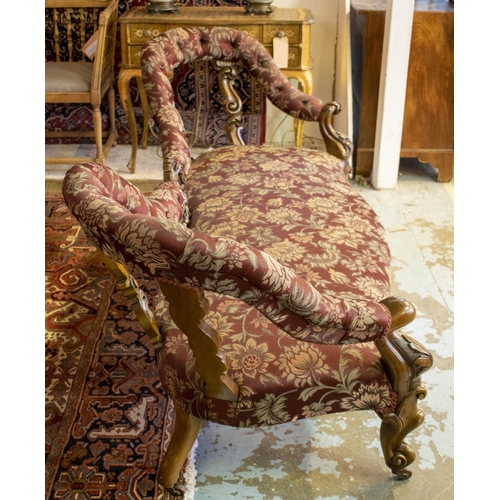 196 - SOFA, 81cm H x 193cm W, circa 1860, Victorian walnut in floral burgundy fabric on ceramic castors.