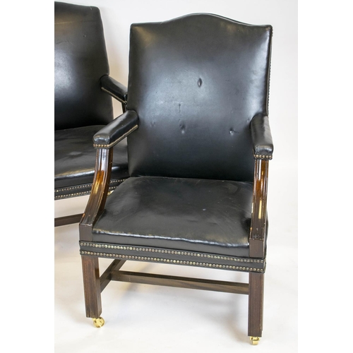 198 - GAINSBOROUGH ARMCHAIRS, a pair, 100cm H x 60cm, George III style in black leather with brass castors... 