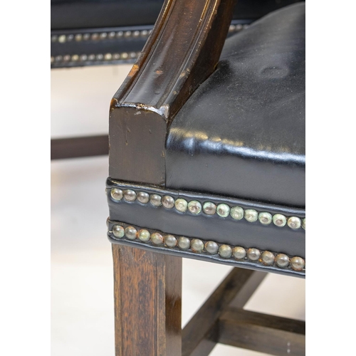 198 - GAINSBOROUGH ARMCHAIRS, a pair, 100cm H x 60cm, George III style in black leather with brass castors... 