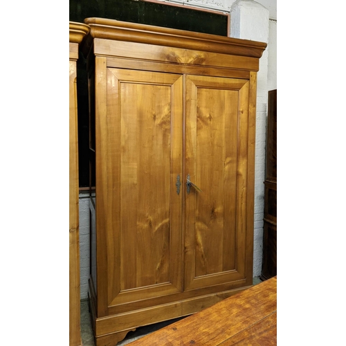 188 - ARMOIRE, mid 19th century Continental cherrywood with two doors enclosing fitted shelves and hanging... 