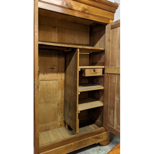 188 - ARMOIRE, mid 19th century Continental cherrywood with two doors enclosing fitted shelves and hanging... 