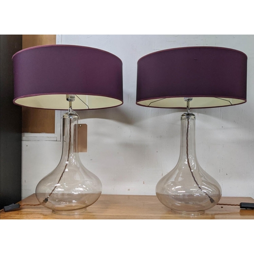 406 - GLASS TABLE LAMPS, a pair, purple shades, baluster shaped bases, 66cm H x 46cm D. (2)