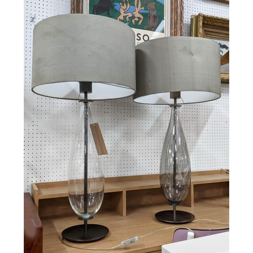 409 - TABLE LAMPS, a pair, grey shades, glass bases of ovoid form, black metal circular bases, 77cm H. (2)