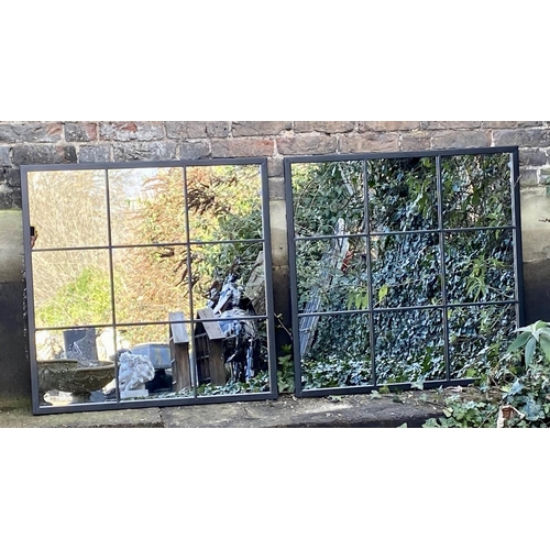 418 - ARCHITECTURAL GARDEN MIRRORS, a pair, black metal frames, 90cm x 99cm.