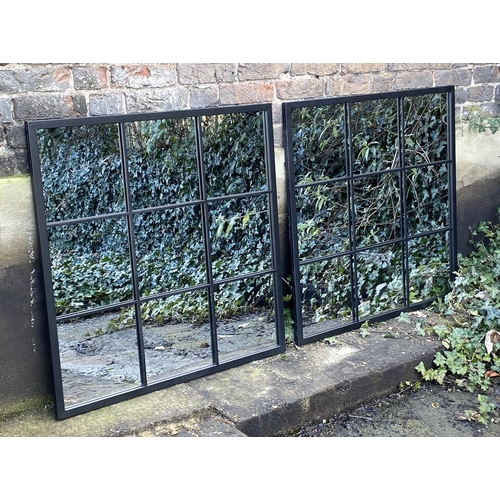 418 - ARCHITECTURAL GARDEN MIRRORS, a pair, black metal frames, 90cm x 99cm.