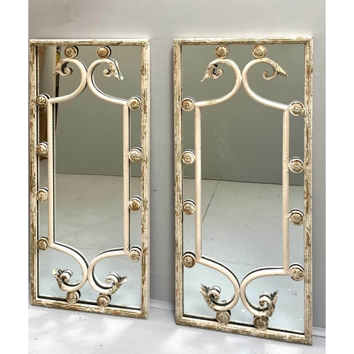 425 - ARCHITECTURAL WALL MIRRORS, a pair, aged metal frames, Italian style design, 112cm x 48cm.