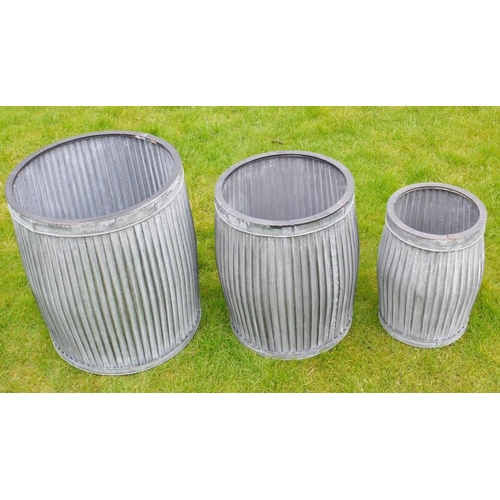 426 - GARDEN PLANTERS, a graduated set of three, largest 50cm high x 45cm diam., galvanised finish.