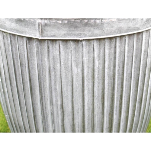 426 - GARDEN PLANTERS, a graduated set of three, largest 50cm high x 45cm diam., galvanised finish.