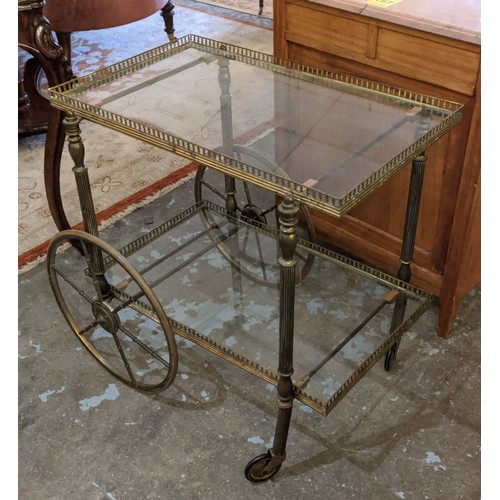 158 - TROLLEY, 73cm x 67cm H x 52cm two tier, each  with a brass gallery and a glass top.