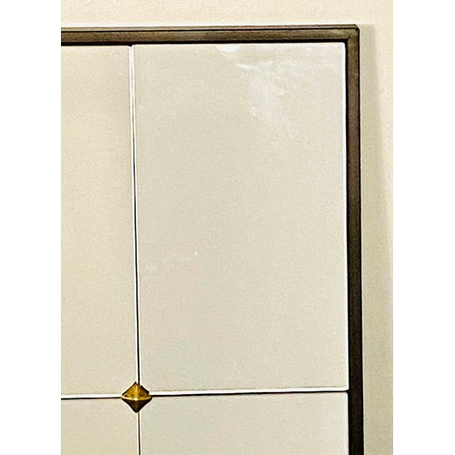 435 - ARCHITECTURAL WALL MIRROR, segmented plate enclosed in black frame, gilt stud detail, 120cm x 70cm.