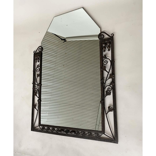 141 - ART DECO WALL MIRROR, French bevelled tapering mirror within a wrought iron foliate and Vitruvian sc... 