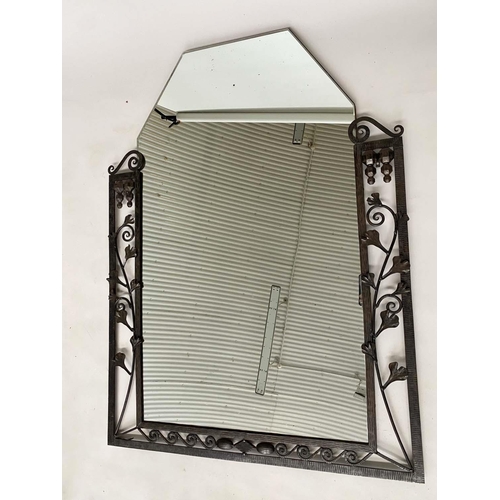 141 - ART DECO WALL MIRROR, French bevelled tapering mirror within a wrought iron foliate and Vitruvian sc... 