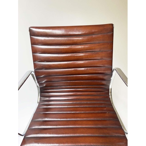 147 - REVOLVING DESK CHAIR, Charles and Ray Eames inspired ribbed tan leather seat revolving and reclining... 