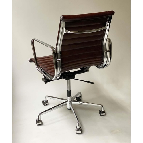 147 - REVOLVING DESK CHAIR, Charles and Ray Eames inspired ribbed tan leather seat revolving and reclining... 