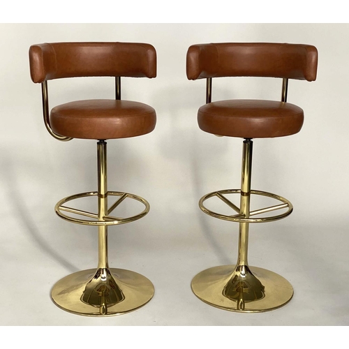 253 - JOHANSON DESIGN SWEDISH BAR STOOLS, a pair, with leather back and seat and gilt brass support, 107cm... 