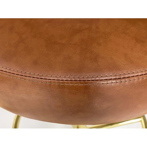253 - JOHANSON DESIGN SWEDISH BAR STOOLS, a pair, with leather back and seat and gilt brass support, 107cm... 