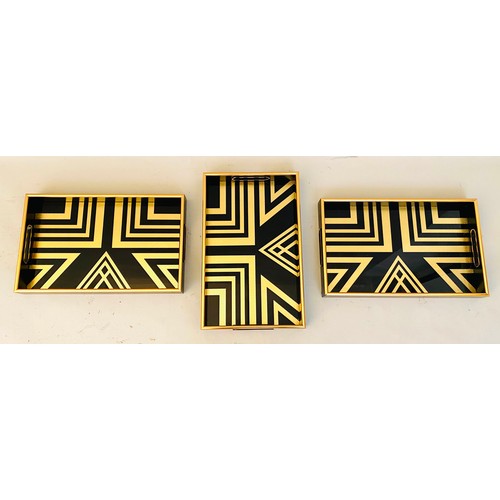 413 - COCKTAIL TRAYS, a set of 3, black and gold art deco style design, 5cm x 40cm x 25cm.