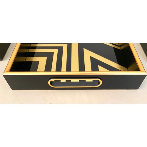 413 - COCKTAIL TRAYS, a set of 3, black and gold art deco style design, 5cm x 40cm x 25cm.