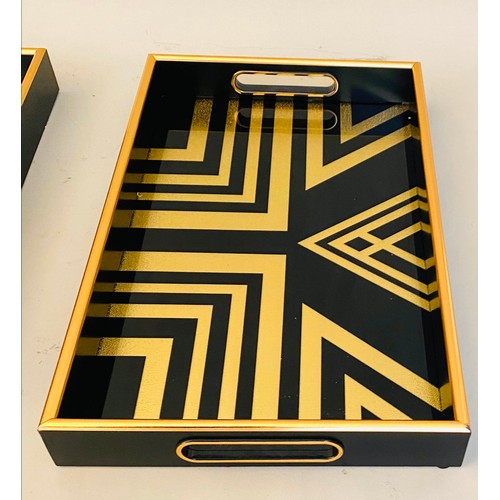 413 - COCKTAIL TRAYS, a set of 3, black and gold art deco style design, 5cm x 40cm x 25cm.