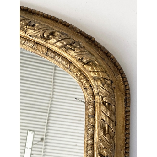 127 - OVERMANTEL MIRROR, 19th century arched giltwood and gesso guilloche and bead moulded with scroll sup... 