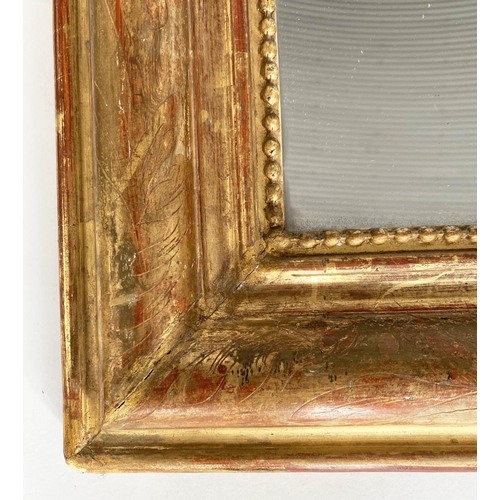 139 - OVERMANTEL MIRROR, 19th century French giltwood and gesso moulded with arched incised and beaded fra... 