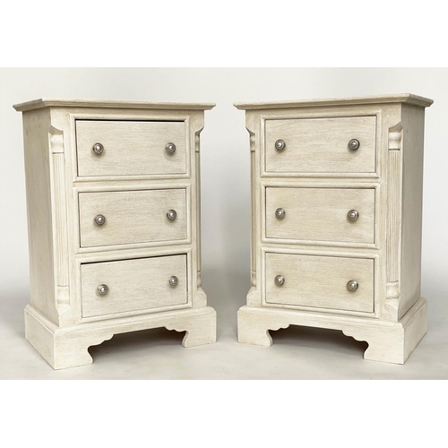 143 - BEDSIDE CHESTS, a pair, Continental style grey painted each with three drawers and reeded corners, 4... 