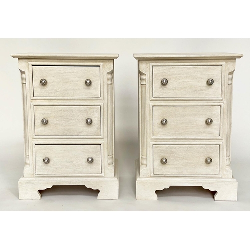 143 - BEDSIDE CHESTS, a pair, Continental style grey painted each with three drawers and reeded corners, 4... 