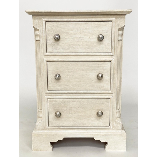 143 - BEDSIDE CHESTS, a pair, Continental style grey painted each with three drawers and reeded corners, 4... 