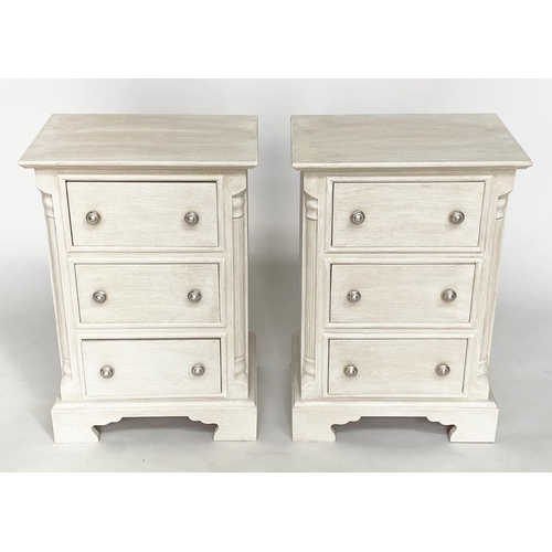 143 - BEDSIDE CHESTS, a pair, Continental style grey painted each with three drawers and reeded corners, 4... 