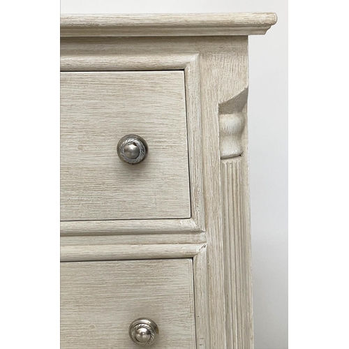 143 - BEDSIDE CHESTS, a pair, Continental style grey painted each with three drawers and reeded corners, 4... 