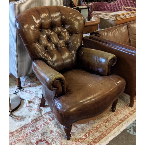 241 - CLUB ARMCHAIRS, a pair, brown leather buttoned backs, spring seats, raised on turned supports, tradi... 