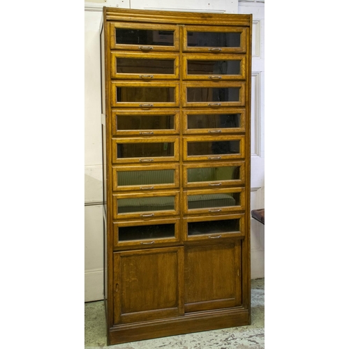 149 - DUDLEY & CO. LTD HABERDASHERY CABINET, 199cm H x 92cm x 53cm, first half 20th century oak with sixte... 