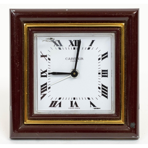 12 - CARTIER TRAVELLING CLOCK, AND PICTURE FRAME, Le Must 1970s in burgundy enamel. (2) 8cm x 8cm