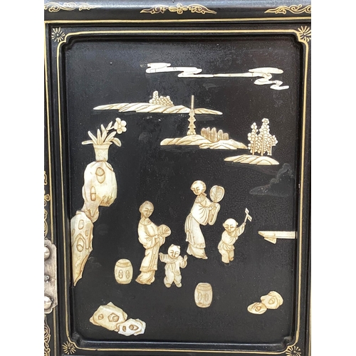 100 - CHINESE SIDE CABINET, early 20th century lacquered and mother and pearl and bone mounted with two pa... 