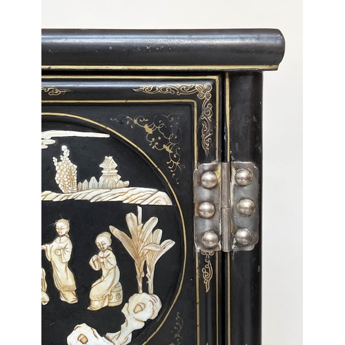 100 - CHINESE SIDE CABINET, early 20th century lacquered and mother and pearl and bone mounted with two pa... 