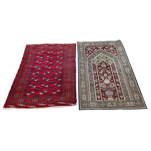 224 - PERSIAN RUG, 167cm x 105cm, together with a bokhara rug, 160cm x 115cm. (2)