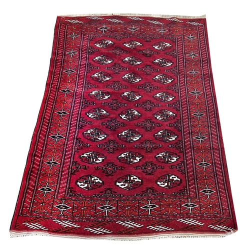 224 - PERSIAN RUG, 167cm x 105cm, together with a bokhara rug, 160cm x 115cm. (2)