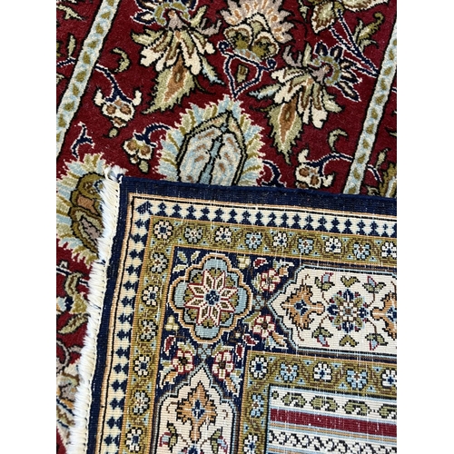 224 - PERSIAN RUG, 167cm x 105cm, together with a bokhara rug, 160cm x 115cm. (2)