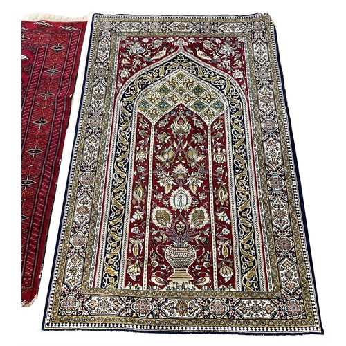 224 - PERSIAN RUG, 167cm x 105cm, together with a bokhara rug, 160cm x 115cm. (2)