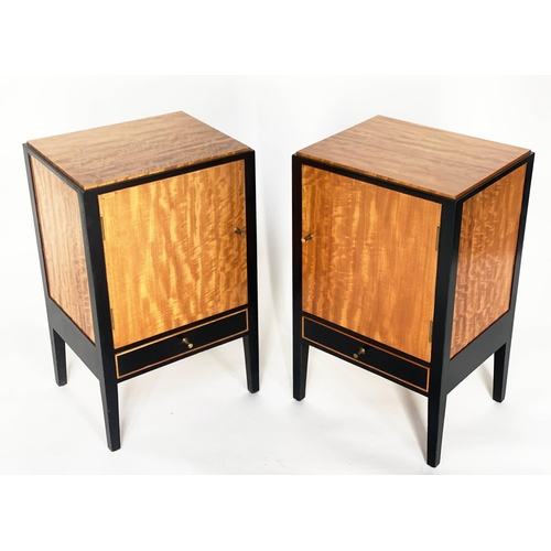 239 - BEDSIDE CABINETS, a pair, 1960s satinwood and ebonised each with panelled door and drawer by 'Loughb... 